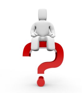 Cartoon man sat on top of a red question mark